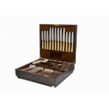 An Art Deco period silver plated canteen of cutlery from Mappin & Webb, in oak presentation case,