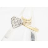 A contemporary 18ct gold heart shaped diamond set dress ring, the princess cuts in white heart on