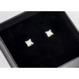 A pair of princess cut diamond stud earrings, in white 18ct gold, diamonds 0.51ct, G-H VS