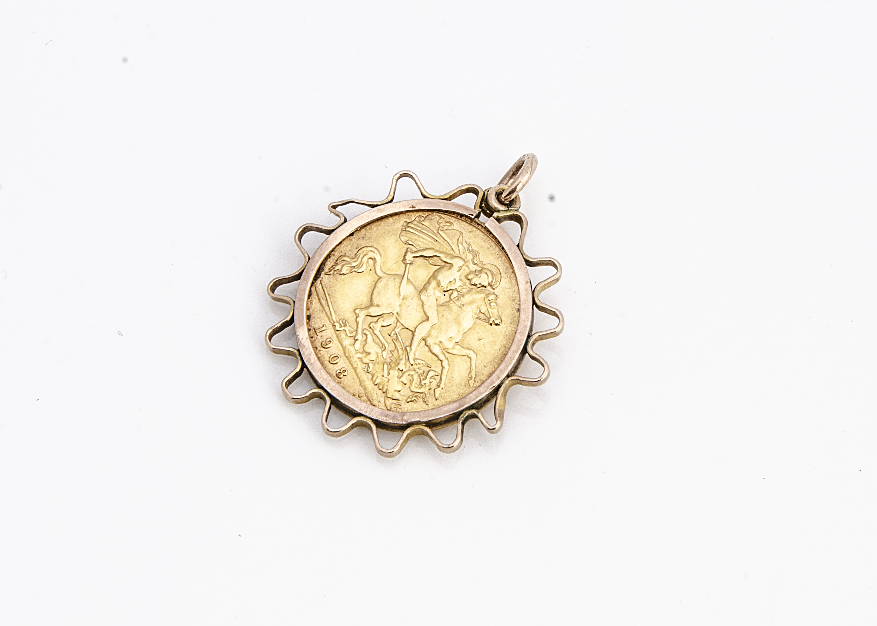 An Edward VII gold half sovereign, dated 1908, presented in a 9ct gold pendant mount, 5.2g