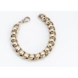 A heavy 9ct gold curb linked and circular collared bracelet, with snap clasp, with millennium