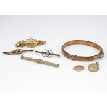 A collection of miscellaneous gold items, including a bangle (af), two gold bar brooches, a gilt