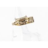 A contemporary 9ct gold dress ring, with central decoration of a pair of dragons either side of a