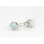 A pair of cabochon white opal ear studs set in silver