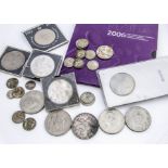 A small collection of coins, including a 1935 crown, several modern crowns and other coins, also a