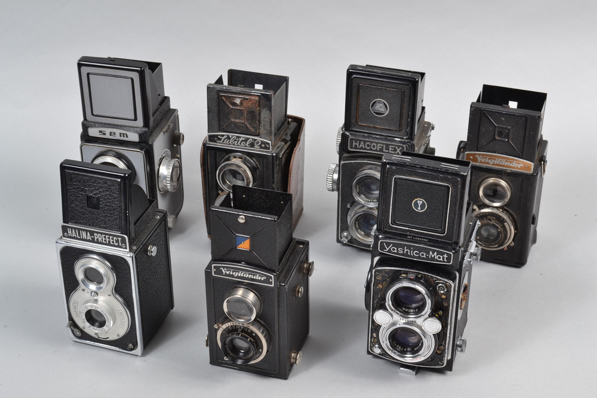 A Tray of TLR Roll Film 6 x 6cm Cameras, comprising Hacoflex, Halina-Prefect, Lubitel 2, Semflex