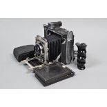 A Graflex Crown Graphic Camera, serial no 714414, body G, bellows G-VG, with Rodenstock Heligon 80mm