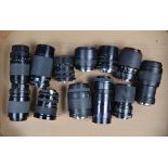 A Tray of Zoom Lenses, manufacturers include Canon, Sigma, Yashica, Tokina, some AF examples, twelve