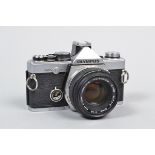 An Olympus OM-2n MD SLR Camera serial no 916332, body F, missing winder drive cover, some paint