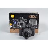 A Nikon D50 DSLR Camera, serial no 6289448, body G-VG, slight tackiness to grip, powers up, takes