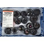 A Tray of SLR Prime Lenses, comprising Canon EF and FD (2) 50mm f/1.8, Nikon Series E 50mm f/1.8, OM