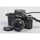 A Nikon F2 Photomic SLR Camera, black, serial no 7160853, body F, paint losses to baseplate,