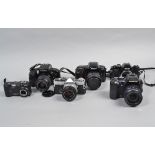 SLR Film Cameras, including an Olympus OM-2 with Zuiko 50mm f/1.8 lens, an Olympus E-500 DSLR with