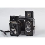 Two Bakelite TLR Cameras, a Plascaflex PS 35, with it's removable focusing magnifier, shutter