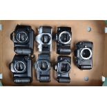 A Tray of SLR Camera Bodies, a Canon AV-1, battery door catch missing, Canon T70, T90 (2), EOS