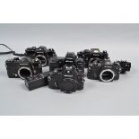 Six Nikon Camera Bodies, a Nikon FT, black, winder/shutter issues, two Nikon EM, both shutters
