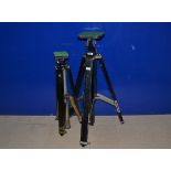 A Gandolfi Studio Tripod. black wood, two section legs, rising center column, tilt head, brass