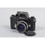 A Nikon F Photomic T SLR Camera, black, serial no 6701013, body F, fungus and small dent to prism,