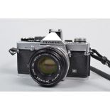 An Olympus OM 2 MD SLR Camera, serial no 1117500, shutter working, meter responsive, timer