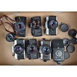 A Tray of SLR Cameras, a Jenaflex AM-1, with Carl Zeiss Jena 50mm f/1.8 lens, a Minolta XG-M, with