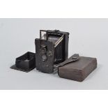A German Miniature Strut Folding Plate Camera, serial no 5585, circa 1910, similar to Ensignette,