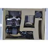 An Olympus OM 1n Camera, shutter working, meter responsive, timer working, body G, scratches to