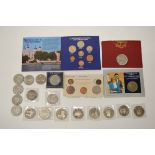 A collection of British commemorative coins, including Crowns, eight £5 coins, 50p and 25p examples,