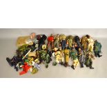 Thirteen Vintage Action Man dolls, together with a good quantity of accessories and clothing