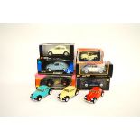 Six boxed 1:18 and 1:24 scale VW Beetle models, including Solido Custom, Solido Prestige, Maisto