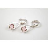 A pair of 9ct gold pink tourmaline and diamond drop earrings, the pear shaped drops with cushion cut