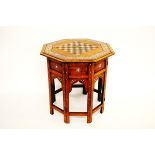 An Anglo Indian hardwood bone and ebony inlaid octagonal chess board table, the octagonal top with