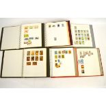 Fourteen stamp albums containing mostly World stamps, countries include DPR Korea, Kuwait, Syria,