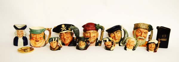 A collection of Royal Doulton character jugs, including Robinson Crusoe D6532, Lumberjack D6610,