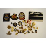 A collection of various military Naval air force and merchant and Royal Navy buttons, cap badges,