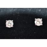 A pair of brilliant cut diamond ear studs, four claw setting on white metal post backs, 0.40ct, 1.