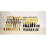 Three contemporary sets of chessmen, in various materials comprising a brass Egyptian style set, a