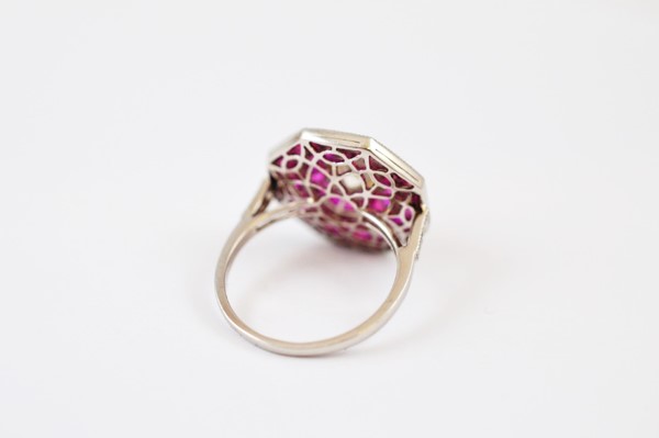 An Art Deco style ruby and diamond octagonal dress ring, with old cut diamond surrounded by two rows - Image 2 of 2