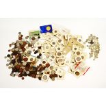 A collection of British and world coins, some in cardboard presentation sleeves, a quantity of loose