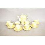 An Art Deco Collingwoods six place coffee set, with transfer printed floral decoration heightened in