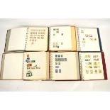 Fourteen stamp albums containing mostly World stamps, countries include USSR, Hawaii, Haiti, Israel,