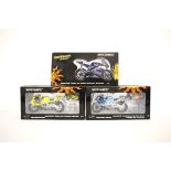 Three Minichamps 1:12 Valentino Rossi Collection motorcycle models, Yamaha YZR-M1 Gauloises Yamaha