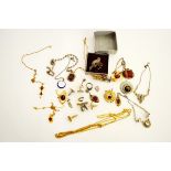 A collection of silver and costume jewels, including an oval agate pendant, two mauve set