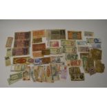 A collection of assorted banknotes, including British £5, 10 shillings, British Armed Forces 3d,