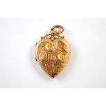 A Victorian 9ct gold fronted heart shaped locket, with scroll bale, 4cm x 2.5cm