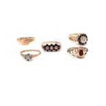 Five 9ct gold rings, including two sapphire and diamond cluster examples, ring size N, a garnet