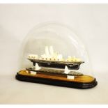 A 19th Century Alabaster Steamship model under glass dome, the black and chalk white model of a