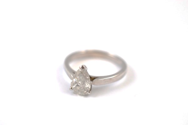 A certificated diamond solitaire, the pear cut diamond in three claw setting on a white 18ct gold