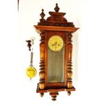 A Vienna wall clock, in a stained beech case, with lacquered brass and pressed metal Art Nouveau