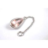 An 18ct gold and morganite drop pendant, the pear shaped beryl within a white metal collar