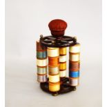 A 19th Century Mahogany and brass Cotton Reel Stand, having pierced cartwheel style top and base,